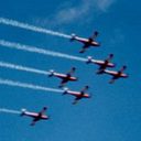 Roulettes in a flying display together with some vintage planes.