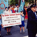 Anzac Day 2002 in Brisbane, Laurie Woods DFC, assisted by his grandchildren (left to right), Denzal, Erica, and Naomi.
